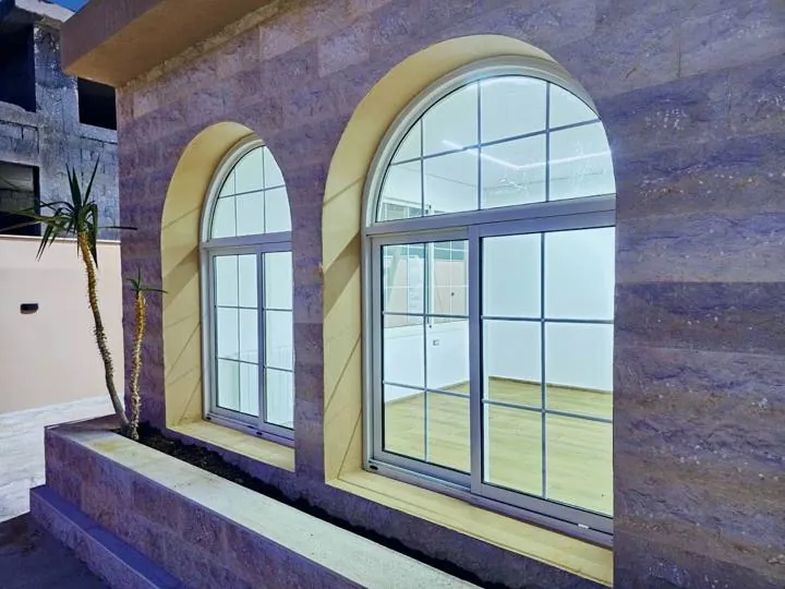 Arched windows with shaped glass and Georgian bars, Ain Zhalta villa